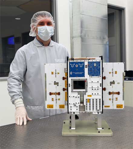 Planetary Resources’ president and CEO Chris Lewicki with the Arkyd 6 spacecraft before delivery to the launch pad. 