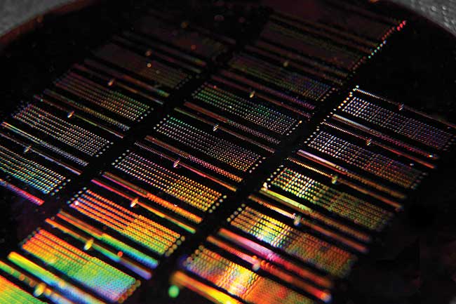 This working integrated photonic wafer created by Rochester Institute of Technology researchers contains thousands of integrated photonic devices including waveguides, filters, couplers, modulators and more. 