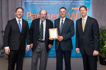 From left, Jeremy Tondreault, BAE Systems, vice president of operations; David Millet, Holographix chairman; David Rowe, Holographix president and CEO; Mike Lewis, BAE Systems vice president of quality. Courtesy of Holographix