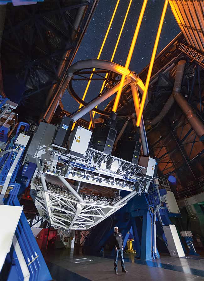 Four lasers excite sodium atoms and create artificial stars, 90 km up in the atmosphere, for the European Southern Observatory’s Very Large Telescope’s adaptive optics systems. Courtesy of European Southern Observatory.