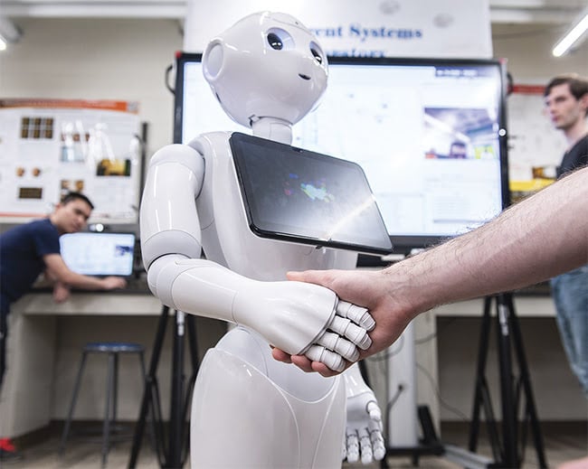 Pepper uses deep learning to articulate gestures such as a handshake. Combined with the small camera mounted on the robot’s head, the software helps Pepper recognize facial expressions and estimate age and gender. Courtesy of Rensselaer Polytechnic Institute.