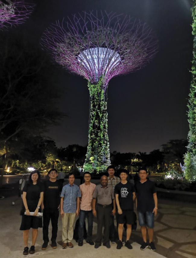 OPSS and SPIE Singapore Student Chapter members on the International Day of Light, May 16. Behind them is a ‘super tree’ at the Gardens by the Bay, which has a nightly light show centered around the trees.