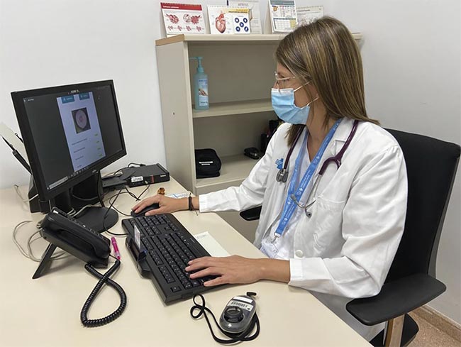 Figure 2. Anna Escalé-Besa analyzes lesion information by feeding it into the AI-powered Autoderm system. Courtesy of Institut Catala de la Salut.