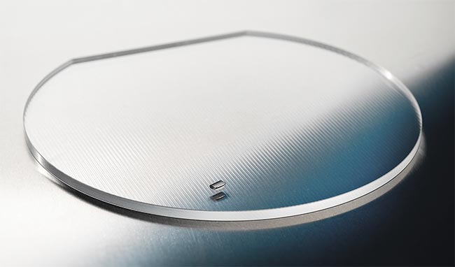 A fiber coupler array (the final product) compared to a wafer (top). Both are made from a glass with a high refractive index.  Offering a wide range of element sizes is crucial to meeting the needs of various micro-optics applications (bottom). Courtesy of Focuslight Technologies.