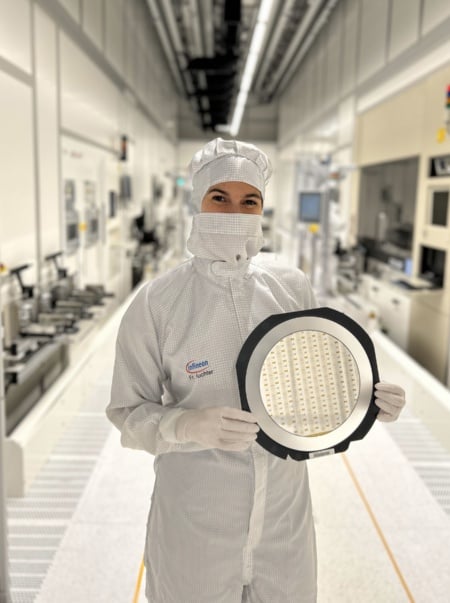 Infineon technical project lead Silke Auchter holding an Infineon wafer with Quantinuum ion trap chips. Courtesy of Infineon Technologies.