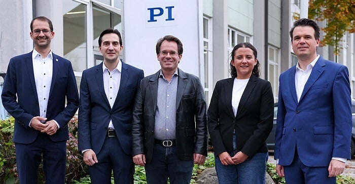 Representatives from both Rosenheim’s local government and PI’s executive team in front of the expanded site. Courtesy of PI.