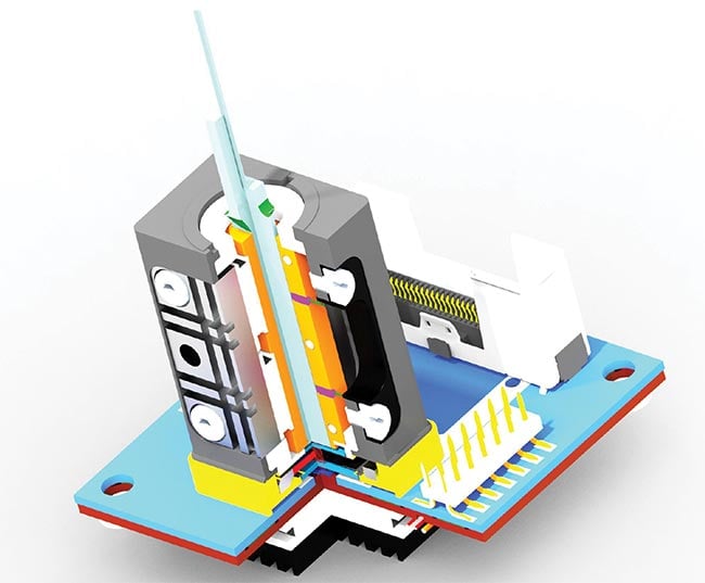 Figure 3. The printed circuit board (PCB) in Figure 2 is shown with the KOVAR frame housing the optics that are fixed on top of the VCSEL chip. The tiny glass tip on top of the housing is the waveguide combiner, where the polarization signal comes to exit. Courtesy of Fraunhofer IOF.