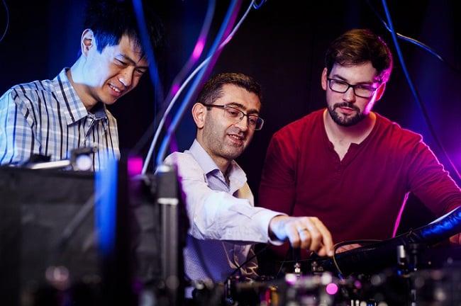 MIT physicists have created a new, long-lasting magnetic state in a material using light. (From left) Tianchuang Luo, professor Nuh Gedik, and researcher Alexander von Hoegen. Courtesy of Adam Glanzman.