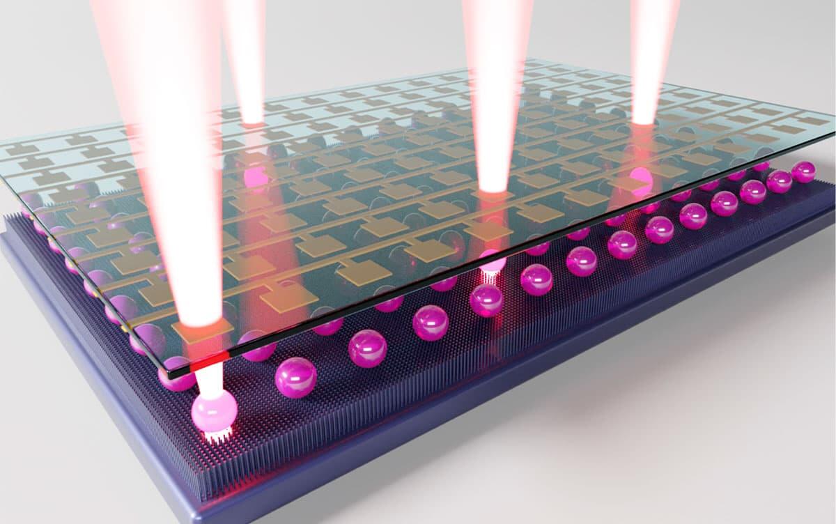 A rendering of the compact laser display created by the researchers. An inkjet printer ejects laser-emitting droplets onto a circuit board and an electric field is applied to them to toggle the light emission of the droplets. Courtesy of Hiroshi Yamagishi.