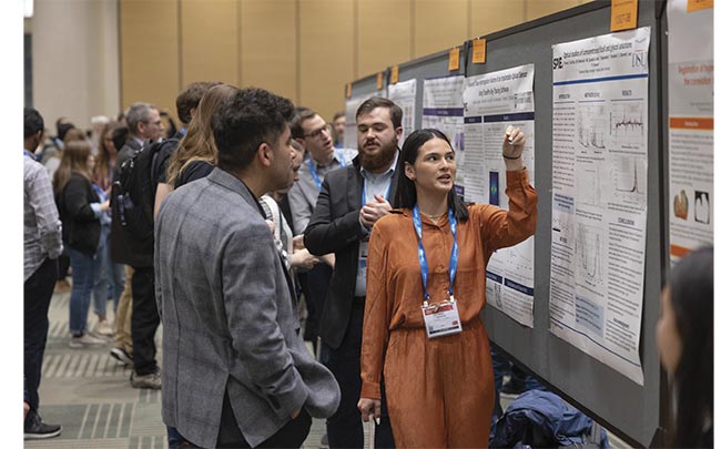 Researchers interact with their colleagues at the annual poster session during SPIE BiOS. Courtesy of SPIE.