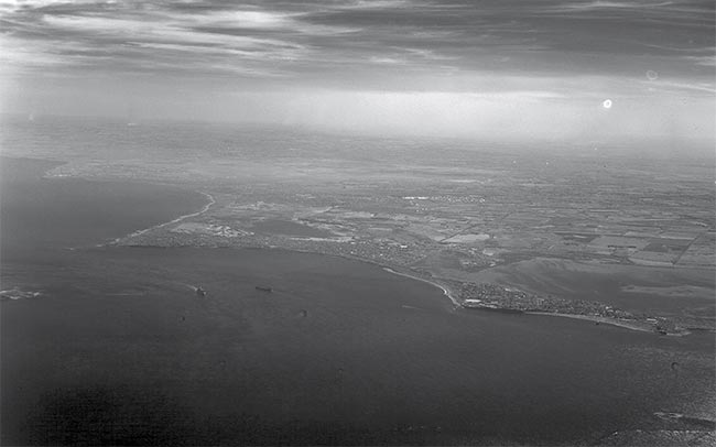 An aerial image through maritime haze and clouds. Courtesy of SWIR Vision Systems.