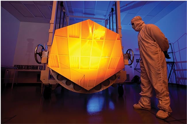 The gold-coated primary mirror of the James Webb Space Telescope comprises 18 individual mirrors. High-reflectivity coatings ensure that reflective optics achieve high levels of performance — such as enabling the measurement of light from extremely distant galaxies — in the most demanding conditions. Courtesy of NASA/DrewNoel.