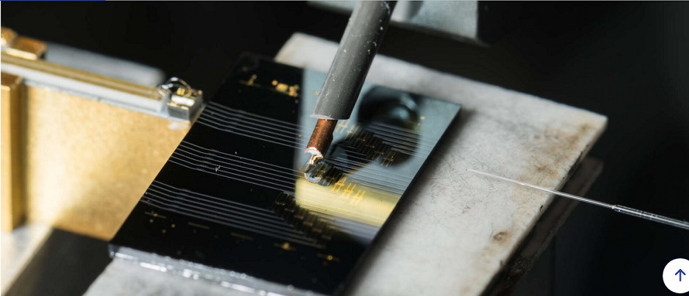 University of Rochester researchers created a chip-scale microcomb laser with an innovative design that allows users to control the optical frequency comb simply by switching on a power source. Courtesy of the University of Rochester/J. Adam Fenster.