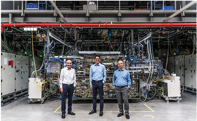 Figure 1. A laser-based secondary source for extreme-ultraviolet (EUV) radiation during the manufacture of the laser system. The system contains a seed laser and a three-stage amplifier based on CO2 technology. Representatives of TRUMPF, ZEISS, and Fraunhofer IOF won the Deutscher Zukunftspreis 2020 (German Future Prize, presented by the Federal President) for the EUV lithography project. Courtesy of TRUMPF Group.