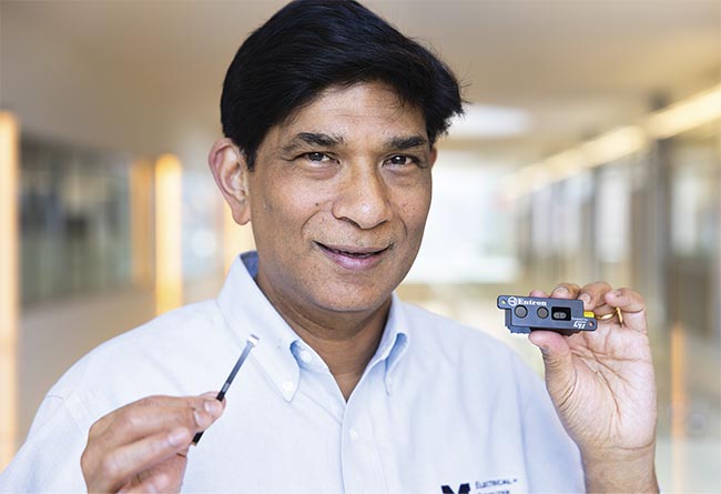 University of Michigan professor of electrical engineering and computer science Mohammed Islam holds up a direct time-of-flight (dToF) sensor (left) and a prototype development kit of a hybrid camera (right). Courtesy of University of Michigan.