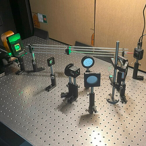 The optics setup the researchers used to test their experiments. The experiments achieved a tracking rate of 6667Hz with a digital micromirror device at a modulation rate of 20kHz. Courtesy of Zihan Geng, Tsinghua University.