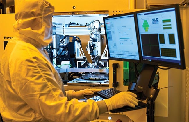 Test engineers conduct measurements of PICs on wafer-level testing platforms. These engineers benefit from early-stage alignment with design engineers to understand the necessary equipment and parameters to optimize testing. Courtesy of VLC Photonics.