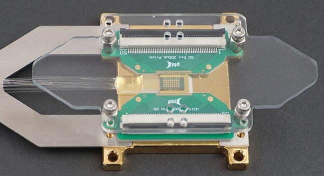 Figure 4. Prototype of a 20-channel-photon-number-resolving (PNR)-detector. The element uses space multiplexing of superconducting nanowire single-photon detectors (SNSPDs). Courtesy of the University Heidelberg.