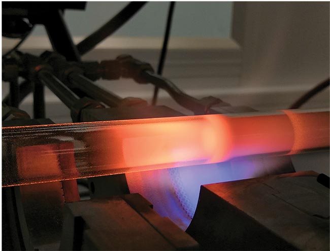 Preform fabrication, one of two leading processes for the manufacture of optical fiber, is based on the oxidation of chemical compounds, including phosphorus oxychloride. Here, the compound is deposited via modified chemical vapor deposition. Courtesy of Coractive Inc.