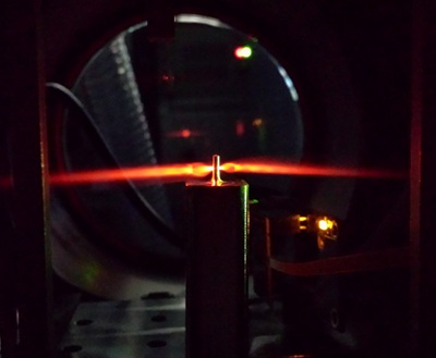 The image captures the generation of attosecond pulses, in which ultrashort laser pulses interact with a neon gas jet. Courtesy of the Institute of Photonic Sciences.
