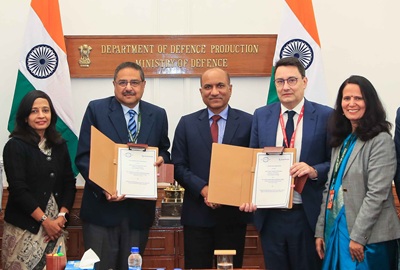India Optel Limited chairman and managing director, Tushar Tripathi, second from left, with head of the Defense Global Business Unit for Safran Electronics and Defense Alexandre Ziegler, second from right, during the signing of an agreement in the presence of secretary of defense production Sanjeev Kumar, center, in New Delhi. Courtesy of Delhi Press Information Bureau.