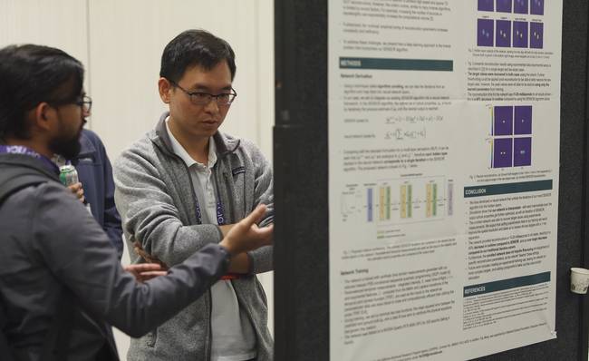 A poster session highlights some of the latest research in biomedical optics and life sciences. Courtesy of Optica.