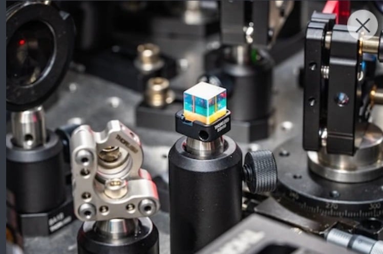 A close-up of a beam-splitter cube among the Harel Group’s laser instrumentation. Using short pulses of light, Harel can produce a molecular movie that captures the vibrational motion of a biological object based on its “sound.” Courtesy of Michigan State University.