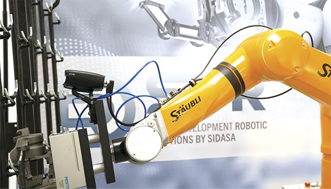 A robot uses a 3D vision system (black camera mounted above the robot arm) during manufacturing and assembly. Courtesy of Zivid.