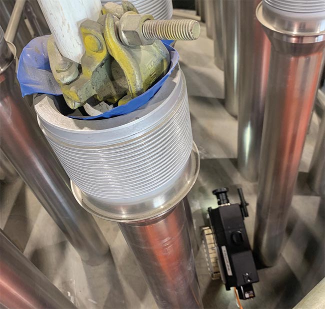 Hinalea’s Model 4400, mounted to a ‘magnetic crawler,’ images a decommissioned nuclear reactor head (top). The hyperspectral camera is tested for its ability to detect pipe leaks by identifying the presence of boric acid corrosion (bottom). Courtesy of Hinalea.