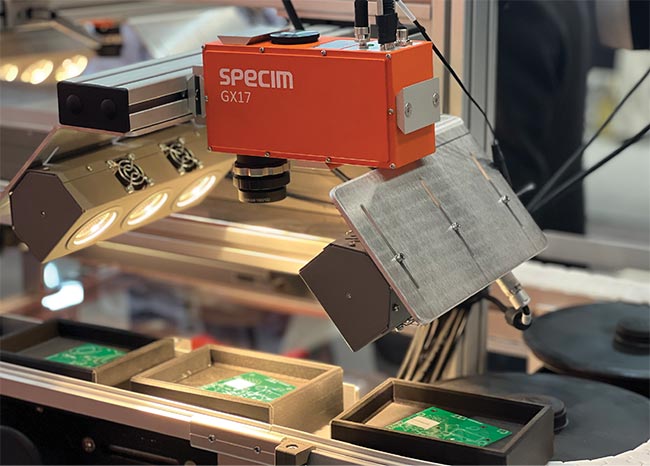 Specim’s GX17 near-infrared hyperspectral camera analyzes the homogeneity and thickness of protective coatings on printed circuit boards. Courtesy of Specim.