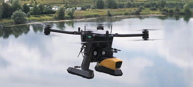 A drone carries YellowScan’s bathymetric lidar system. The lidar system uses a green laser at 532 nm for underwater scanning. Courtesy of YellowScan.