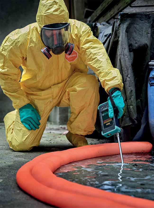 A first responder uses a hand-held Raman analyzer to identify the compound xylene during a chemical spill response. A fiber optic immersion probe accessory provides high chemical resistance and can be used directly with the sample. Courtesy of Metrohm.