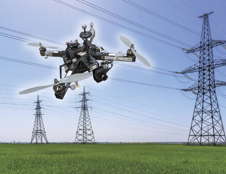 A drone approaches a high-voltage electrical transmission tower. Courtesy of aau/Müller.