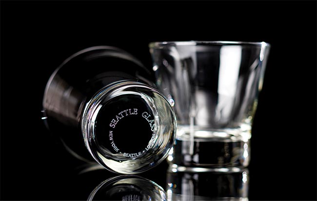 Figure 1. Laser marking with a CO2 laser and an optimized scan head is performed on standard glassware (top) and architectural glass (bottom). Courtesy of Novanta.