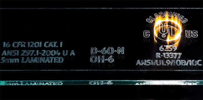 Figure 1. Laser marking with a CO2 laser and an optimized scan head is performed on standard glassware (top) and architectural glass (bottom). Courtesy of Novanta.